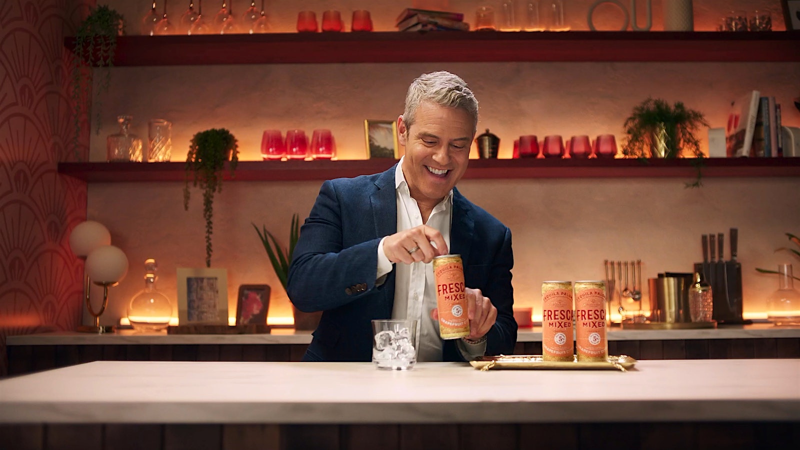 Bravo TV star Andy Cohen serves himself a Fresca Mixed Tequila Paloma ready-to-drink premixed canned cocktail.